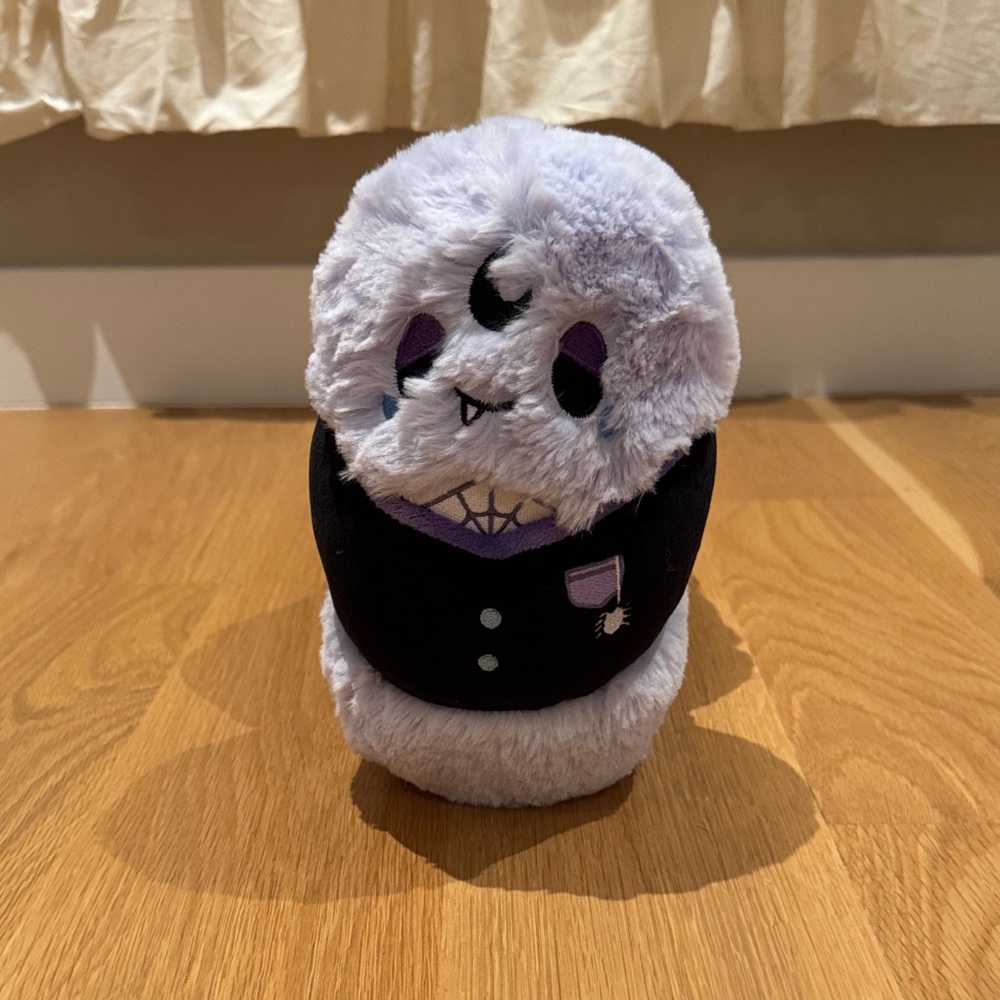 Adorable Black and Purple Stuffed Animal